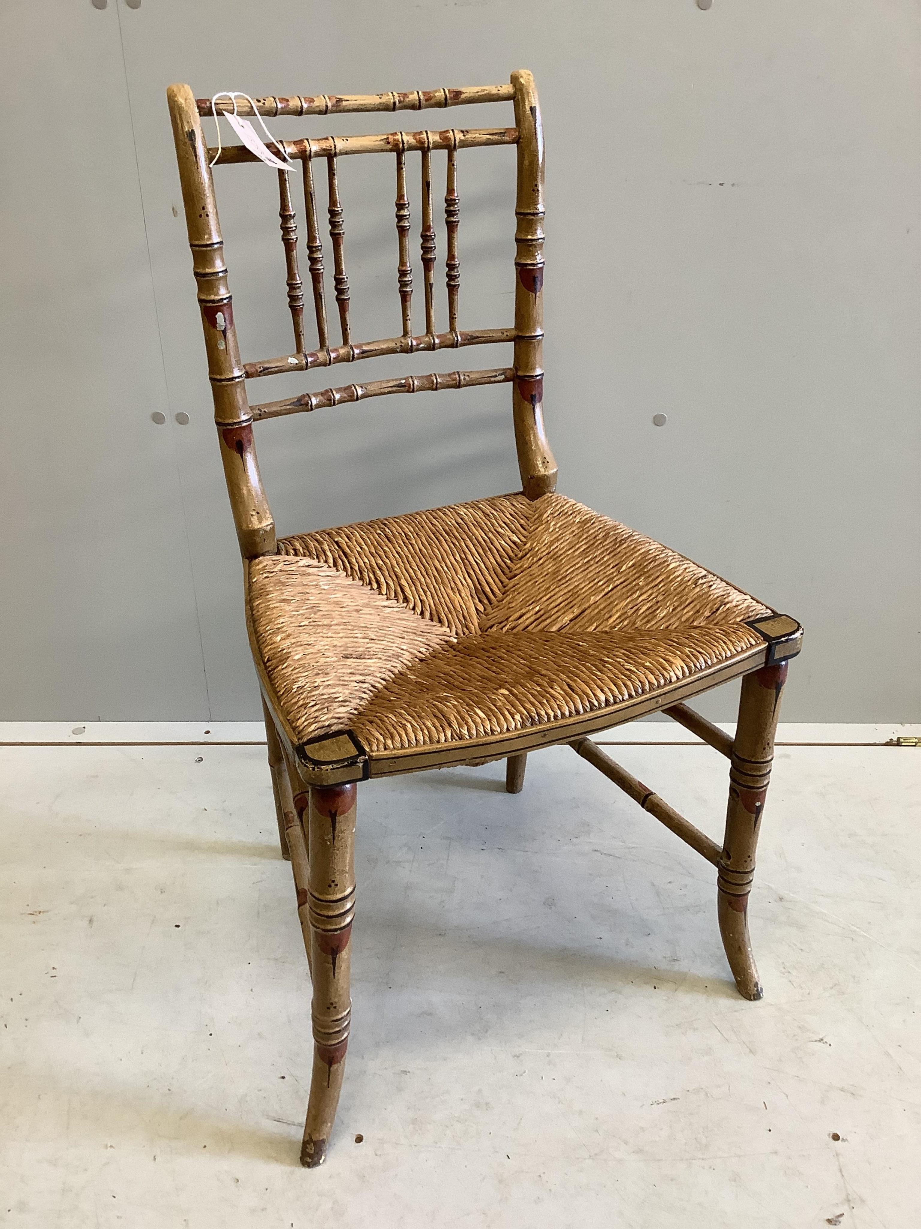A Regency painted simulated bamboo side chair, original paint with caned seat